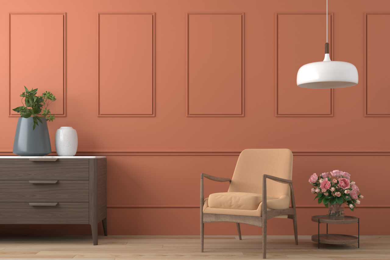 orange interior design with armchair, lamp, table and roses